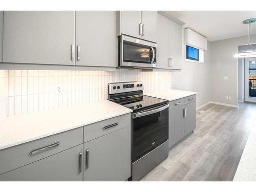 23 Wolf Hollow Way Se, Calgary, AB - Indoor Photo Showing Kitchen