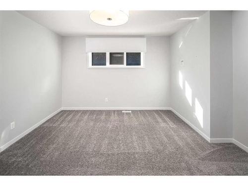 23 Wolf Hollow Way Se, Calgary, AB - Indoor Photo Showing Other Room