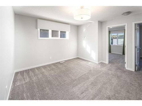 23 Wolf Hollow Way Se, Calgary, AB - Indoor Photo Showing Other Room