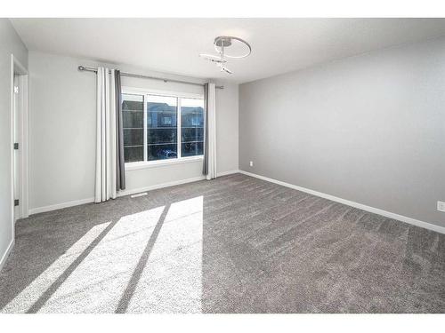 23 Wolf Hollow Way Se, Calgary, AB - Indoor Photo Showing Other Room