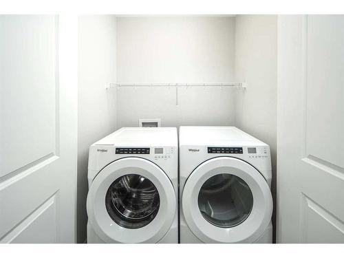 23 Wolf Hollow Way Se, Calgary, AB - Indoor Photo Showing Laundry Room