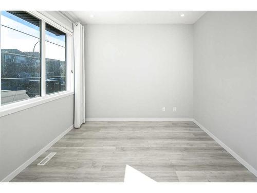 23 Wolf Hollow Way Se, Calgary, AB - Indoor Photo Showing Other Room