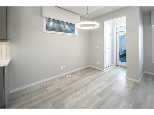 23 Wolf Hollow Way Se, Calgary, AB - Indoor Photo Showing Other Room