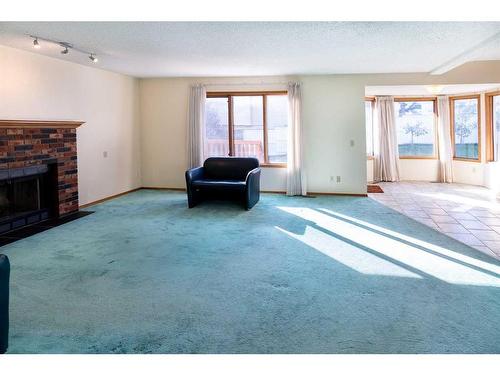 135 Sandringham Road Nw, Calgary, AB - Indoor Photo Showing Living Room With Fireplace