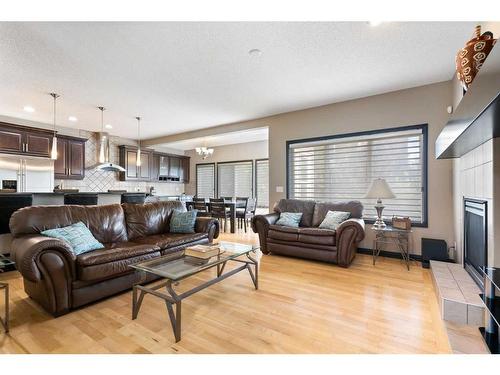 168 Sunset View, Cochrane, AB - Indoor Photo Showing Living Room