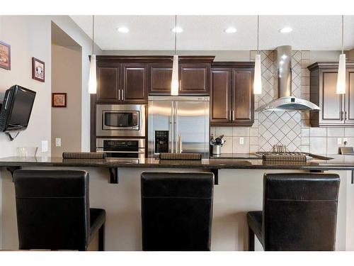 168 Sunset View, Cochrane, AB - Indoor Photo Showing Kitchen With Upgraded Kitchen