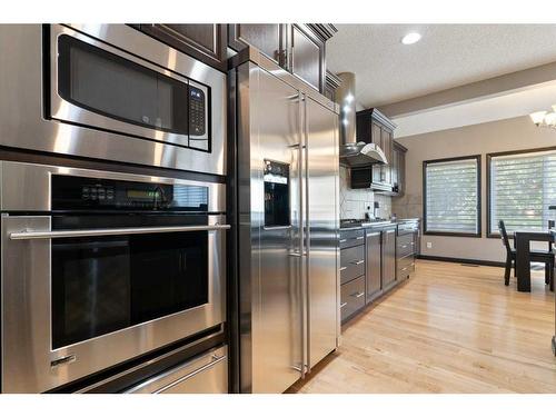 168 Sunset View, Cochrane, AB - Indoor Photo Showing Kitchen With Stainless Steel Kitchen