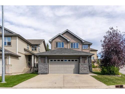 168 Sunset View, Cochrane, AB - Outdoor With Facade