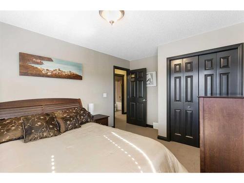 168 Sunset View, Cochrane, AB - Indoor Photo Showing Bedroom