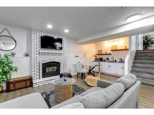 104 Mckerrell Crescent Se, Calgary, AB - Indoor Photo Showing Living Room With Fireplace