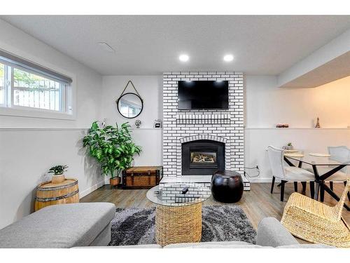 104 Mckerrell Crescent Se, Calgary, AB - Indoor Photo Showing Living Room With Fireplace