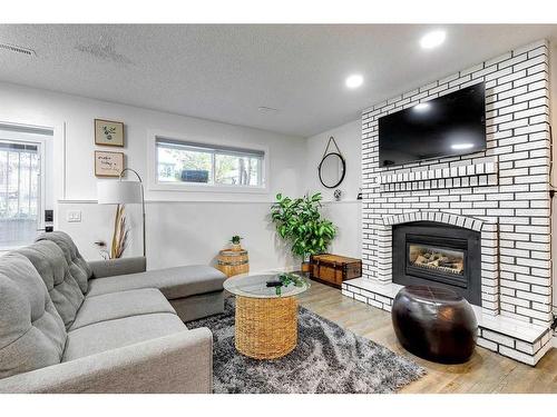 104 Mckerrell Crescent Se, Calgary, AB - Indoor Photo Showing Living Room With Fireplace