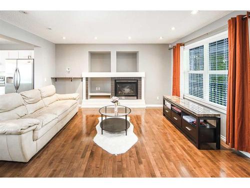 127 Covepark Place Ne, Calgary, AB - Indoor Photo Showing Living Room With Fireplace