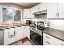 127 Covepark Place Ne, Calgary, AB  - Indoor Photo Showing Kitchen With Double Sink 