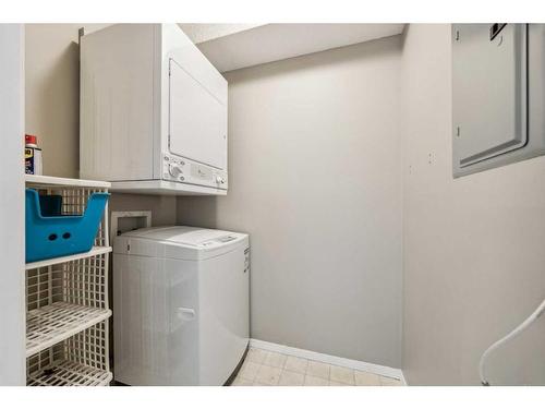 1228-2371 Eversyde Avenue Sw, Calgary, AB - Indoor Photo Showing Laundry Room