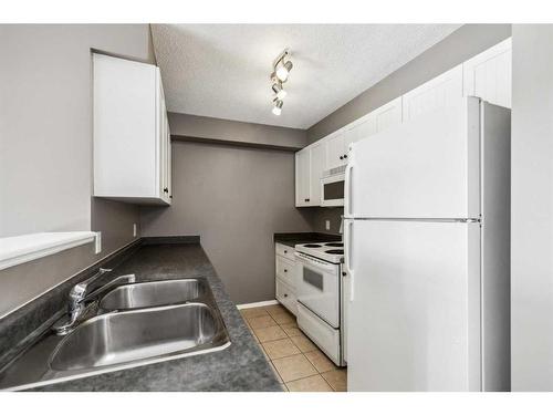 1228-2371 Eversyde Avenue Sw, Calgary, AB - Indoor Photo Showing Kitchen With Double Sink