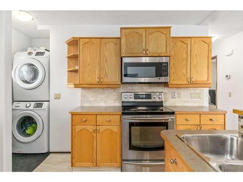 79 Lake Sylvan Close Se, Calgary, AB - Indoor Photo Showing Laundry Room