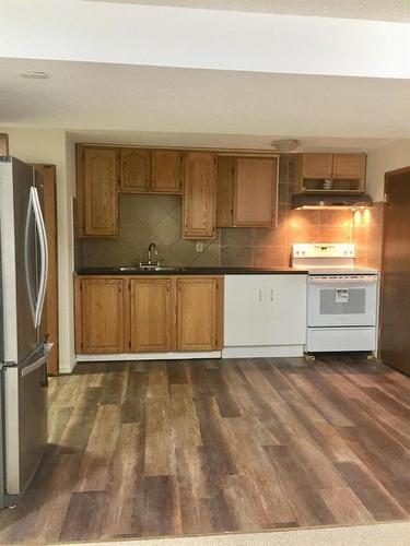 79 Lake Sylvan Close Se, Calgary, AB - Indoor Photo Showing Kitchen With Double Sink