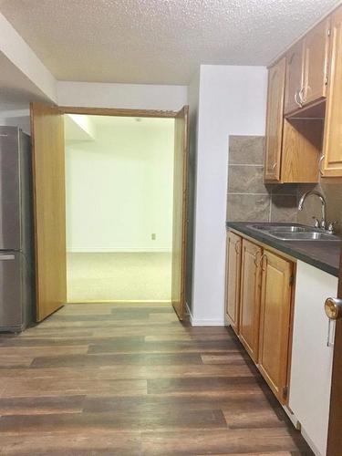 79 Lake Sylvan Close Se, Calgary, AB - Indoor Photo Showing Kitchen With Double Sink