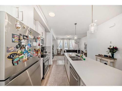 801-33 Merganser Drive West, Chestermere, AB - Indoor Photo Showing Kitchen With Double Sink With Upgraded Kitchen