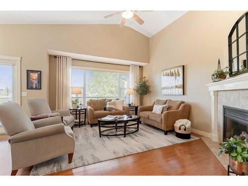 123 West Creek Meadow, Chestermere, AB - Indoor Photo Showing Living Room With Fireplace