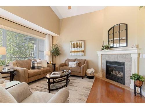 123 West Creek Meadow, Chestermere, AB - Indoor Photo Showing Living Room With Fireplace