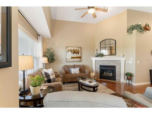 123 West Creek Meadow, Chestermere, AB - Indoor Photo Showing Living Room With Fireplace