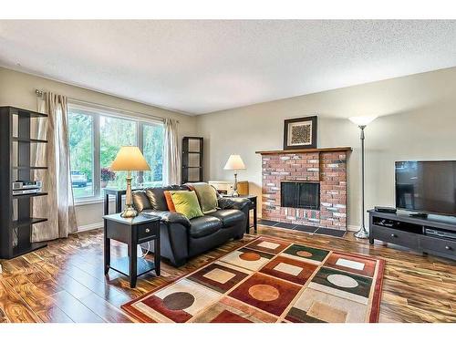 44 Sunhurst Place Se, Calgary, AB - Indoor Photo Showing Living Room With Fireplace