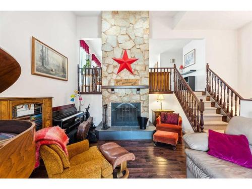 120 Tucker Road Se, Airdrie, AB - Indoor Photo Showing Living Room With Fireplace