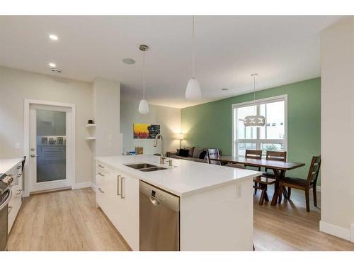 103-1921 27 Street Sw, Calgary, AB - Indoor Photo Showing Kitchen With Double Sink