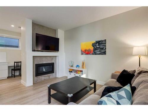 103-1921 27 Street Sw, Calgary, AB - Indoor Photo Showing Living Room With Fireplace