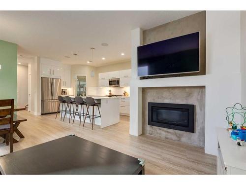 103-1921 27 Street Sw, Calgary, AB - Indoor Photo Showing Living Room With Fireplace