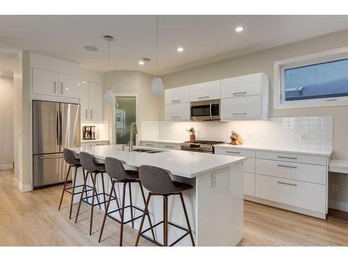 103-1921 27 Street Sw, Calgary, AB - Indoor Photo Showing Kitchen With Double Sink With Upgraded Kitchen