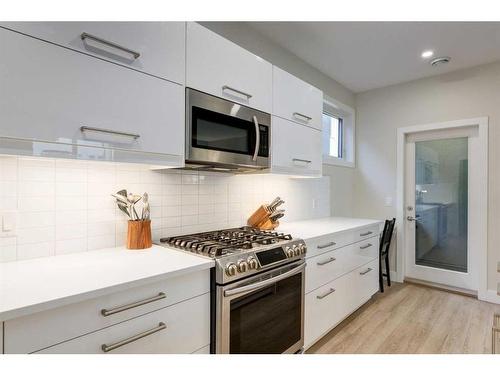 103-1921 27 Street Sw, Calgary, AB - Indoor Photo Showing Kitchen With Upgraded Kitchen