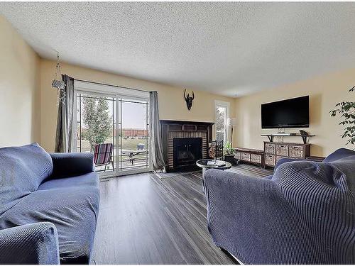 96 Beddington Circle Ne, Calgary, AB - Indoor Photo Showing Living Room With Fireplace