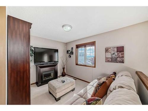 618 Rocky Ridge View Nw, Calgary, AB - Indoor With Fireplace