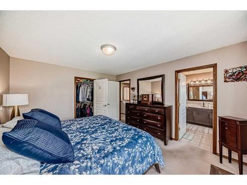 618 Rocky Ridge View Nw, Calgary, AB - Indoor Photo Showing Bedroom