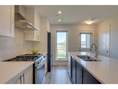 211-260 Rowley Way Nw, Calgary, AB - Indoor Photo Showing Kitchen With Double Sink With Upgraded Kitchen