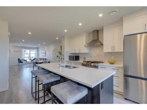 211-260 Rowley Way Nw, Calgary, AB - Indoor Photo Showing Kitchen With Double Sink With Upgraded Kitchen