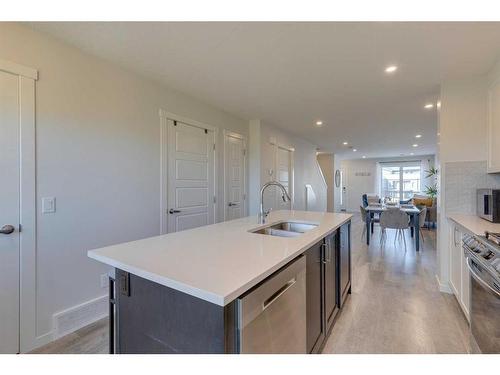 211-260 Rowley Way Nw, Calgary, AB - Indoor Photo Showing Kitchen With Double Sink