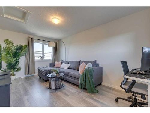 211-260 Rowley Way Nw, Calgary, AB - Indoor Photo Showing Living Room