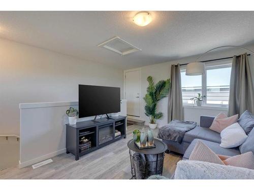 211-260 Rowley Way Nw, Calgary, AB - Indoor Photo Showing Living Room