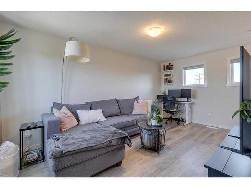 211-260 Rowley Way Nw, Calgary, AB - Indoor Photo Showing Living Room