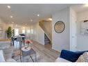 211-260 Rowley Way Nw, Calgary, AB  - Indoor Photo Showing Living Room 