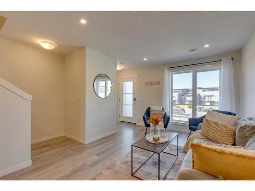 211-260 Rowley Way Nw, Calgary, AB - Indoor Photo Showing Living Room