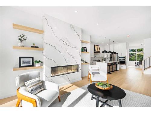 415 18 Avenue Nw, Calgary, AB - Indoor Photo Showing Living Room With Fireplace