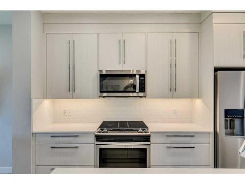 1245 Carrington Boulevard Nw, Calgary, AB - Indoor Photo Showing Kitchen With Upgraded Kitchen