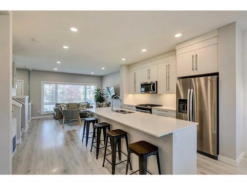 1245 Carrington Boulevard Nw, Calgary, AB - Indoor Photo Showing Kitchen With Double Sink With Upgraded Kitchen