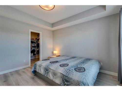 1245 Carrington Boulevard Nw, Calgary, AB - Indoor Photo Showing Bedroom