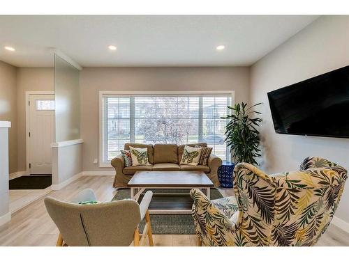 1245 Carrington Boulevard Nw, Calgary, AB - Indoor Photo Showing Living Room With Fireplace